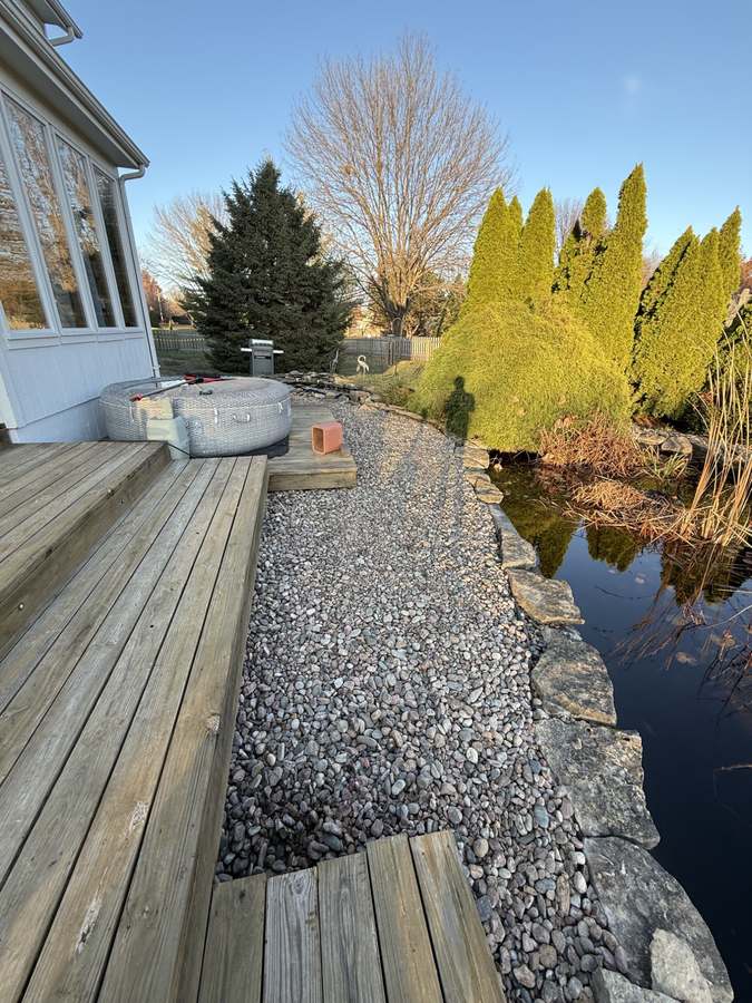 Decorative river rock pathway and landscape design